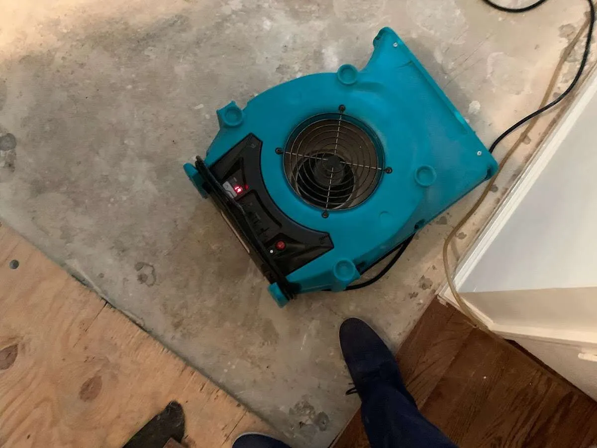 Air mover drying subfloor during Leak Detection & Repair in Colville